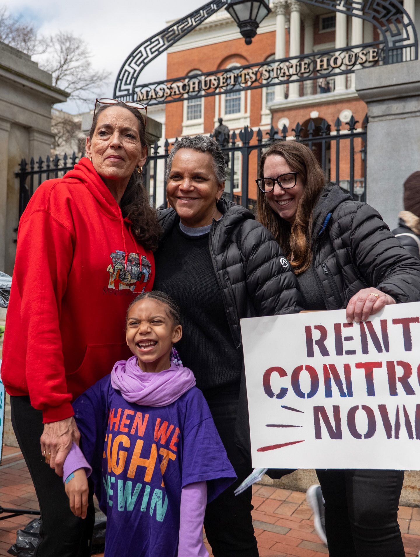 Andrea James campaign for Massachusetts Governor with community members and a sign calling for "Rent Control Now"